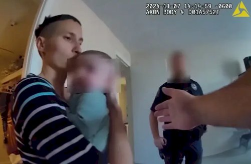 Moment mother and her baby were shot de@d after she charged at police with huge knife (video)