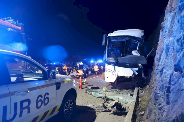 At least three d£@d after coach full of tourists crashes into cliff face